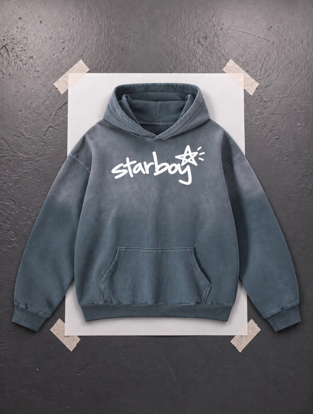 Starboy Essential slate sun-dyed heavyweight hoodie flat lay, white hand-drawn script logo on front