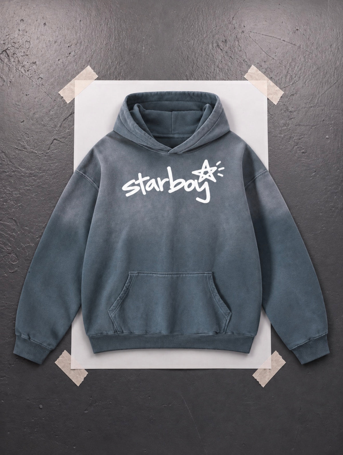 Starboy Essential slate sun-dyed heavyweight hoodie flat lay, white hand-drawn script logo on front